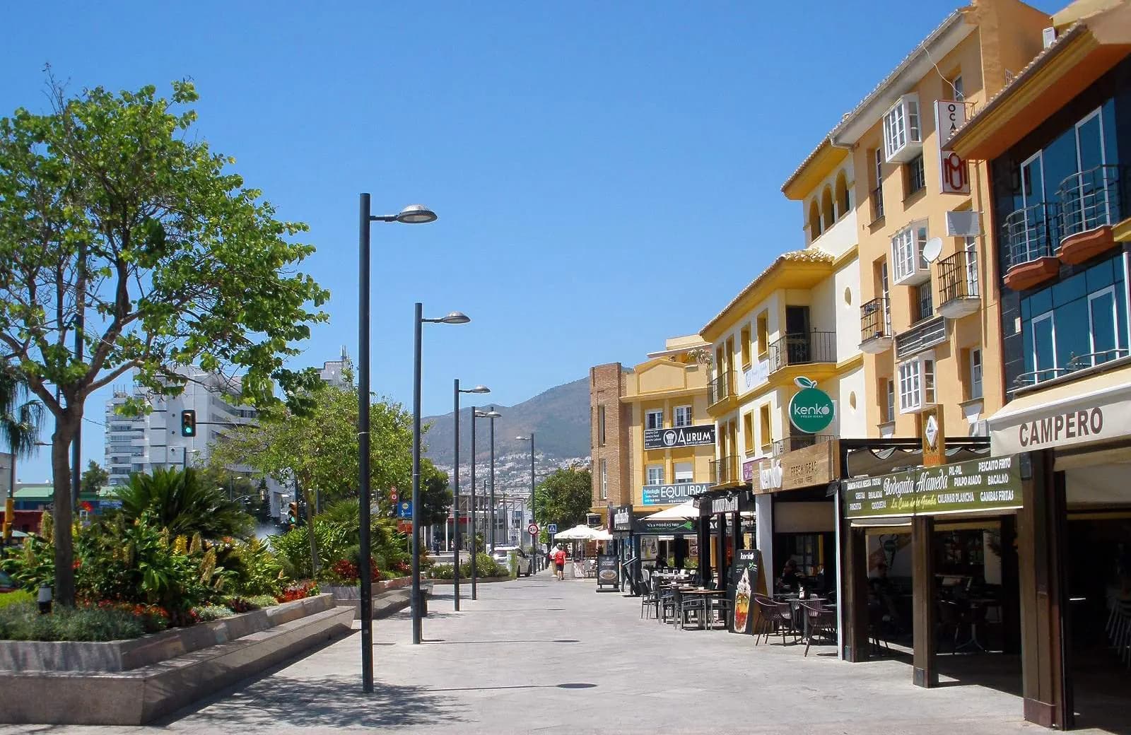 Pedestrian avenue with shops and cafés in Arroyo de la Miel