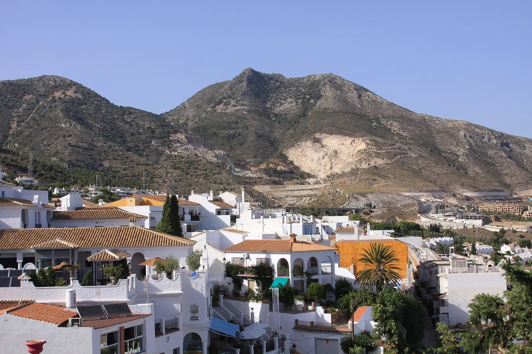 White houses of Benalmádena Pueblo beneath the mountains